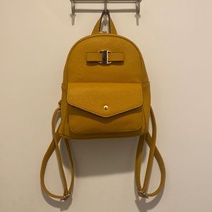 Mustard yellow, vegan leather, mini backpack.
